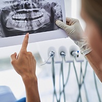 Dentist and patient discuss advanced dental implant procedures in Allen