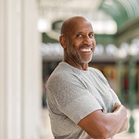 Confident smiling man with dental implants in Allen