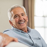 Senior man enjoying long-term benefits of dental implants