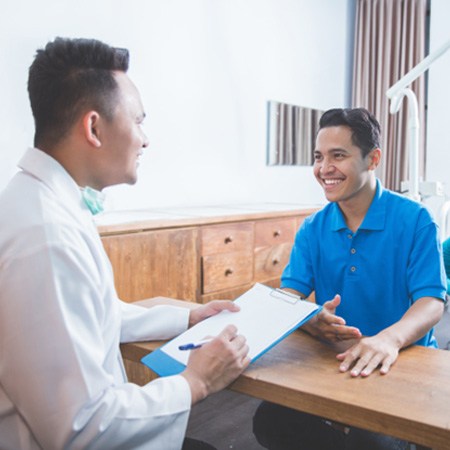 dentist talking to patient about financing options 