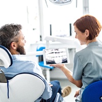 Patient reviewing X-Ray results with dental team member