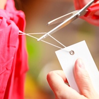 Using scissors, not teeth, to cut tag off clothing
