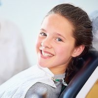 Smiling girl in dental exam room