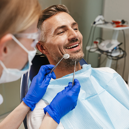 Man smiling during routine dental care visit in Allen