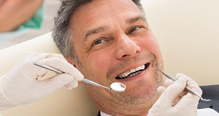 Man  receiving dental exam