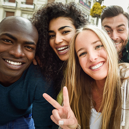 Selfie of four smiling adults