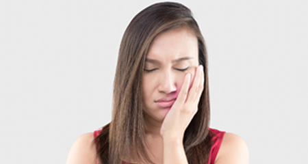 Woman with facial pain needs TMJ therapy in Allen