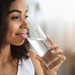 Woman drinking a glass of water