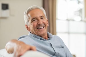 An older man smiling