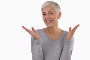 mature Woman smiling with dental implants