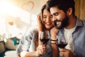 Young couple drinking wine together