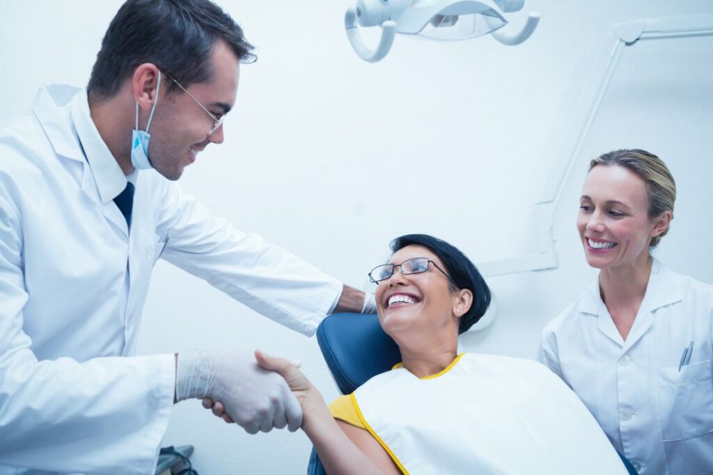 A woman meeting her dentist at a dental consultation